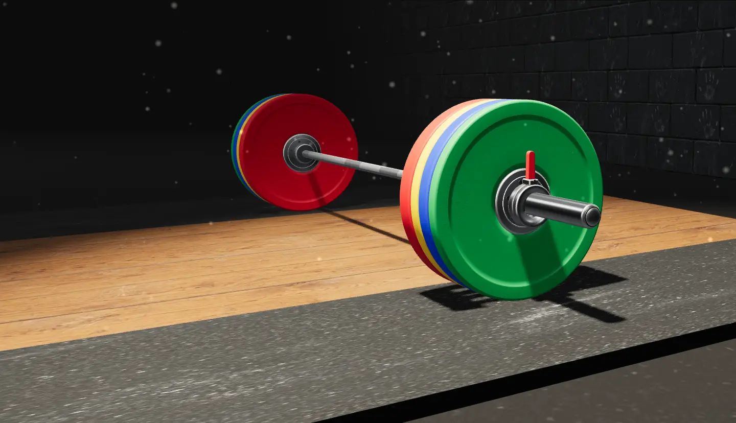 Close-up of a barbell sleeve loaded with red, yellow, blue and green bumper plates under a spotlight